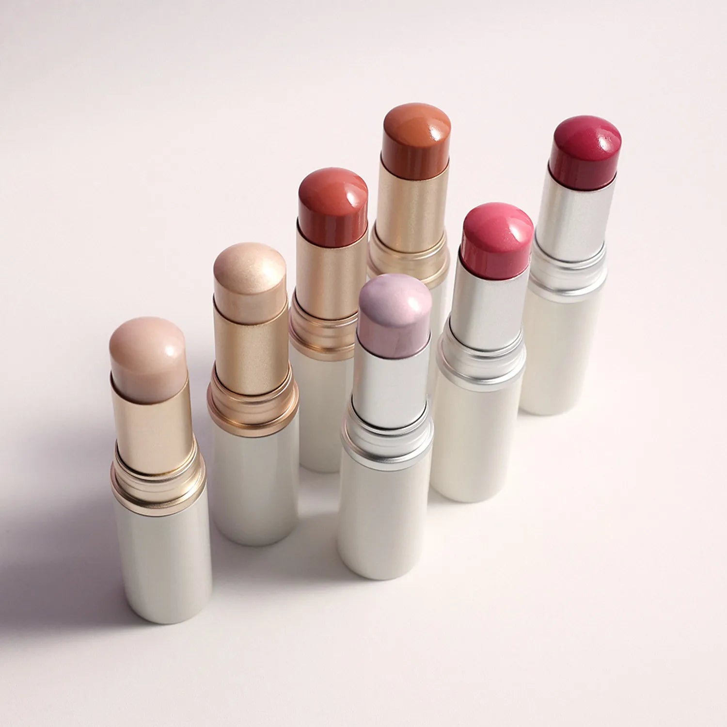 Set of lipsticks with various shades on a light background